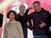North Macedonia opposition party VMRO-DPMNE leader Hristijan Mickoski stands next to presidential candidate Gordana Siljanovska-Dafkova during an electoral meeting in Kumanovo