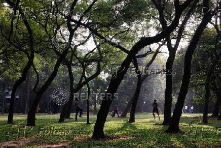 People exercise at Ramna Park in the morning, in Dhaka