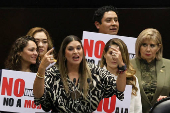 Congress members oppose a reform during a session, in Mexico City