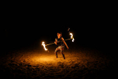 A fire dancer performs on Venice Beach