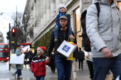 Shoppers walk on Oxford Street in London