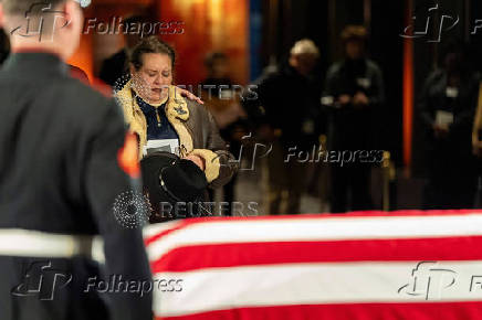 A mourner reacts near the casket of former President Jimmy Carter in Atlanta