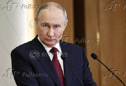 Russian President Putin attends a press conference in Astana