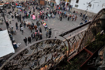 People gather outside the Umayyad Mosque, in Damascus