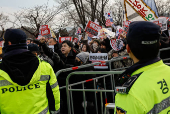 Pro-Yoon supporters shout while expressing their stance on the media?s coverage during a rally outside the Seoul Detention Center in Uiwang