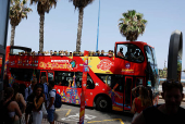 A tourist bus makes a stop to pick up more tourists in Las Palmas de Gran Canaria
