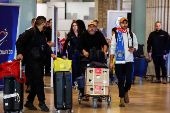 Israeli Maccabi Tel Aviv soccer fans arrive at the Ben Gurion International Airport