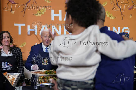 U.S. President Biden attends a dinner with U.S. service members and their families ahead of Thanksgiving at U.S. Coast Guard Sector New York on Staten Island