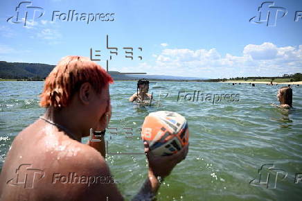 People find relief from the summer heat at Penrith Beach in Australia