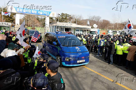 Scenes from outside the Seoul Detention Center in Uiwang