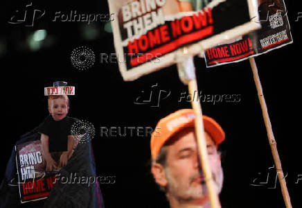 People gather to mark the second birthday of the youngest hostage in Gaza, Kfir Bibas, in Tel Aviv