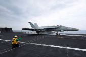 FILE PHOTO: A F/A-18E Super Hornet fighter jet is catapulted off the flight deck of the USS Dwight D. Eisenhower (CVN 69) aircraft carrier in Southern Red Sea, Middle East