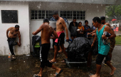 Migrant caravan stops to rest before moving on its way to the U.S.-Mexico border, in Escuintla