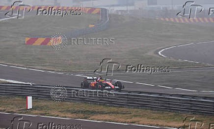 Lewis Hamilton drives a Ferrari F1 car around the Fiorano circuit as part of the TPC tests