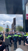 Police clash with demonstrators during a protest at the University of Amsterdam
