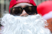 Revellers take part in SantaCon in New York City