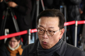 Seok Dong-hyeon, a lawyer for South Korea's impeached President Yoon Suk Yeol, arrives at a court, in Seoul