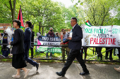 People protest the conflict between Israel and the Palestinian Islamist group Hamas, across the entrance to Yale, prior to commencement at Yale University
