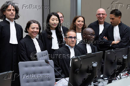 The prosecution team, with Deputy Prosecutor Mame Mandiaye Niang, poses for a group picture in court before the verdict of Al Hassan Ag Abdoul Aziz Ag Mohamed Ag Mahmoud at the International Criminal Court in The Hague