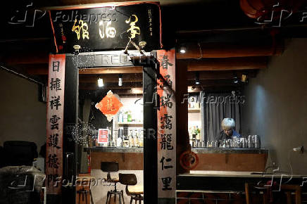 Powei Lee, 31, owner of Kinmen Mojo Bar (or Vent Bar) works at the bar in Kinmen Island