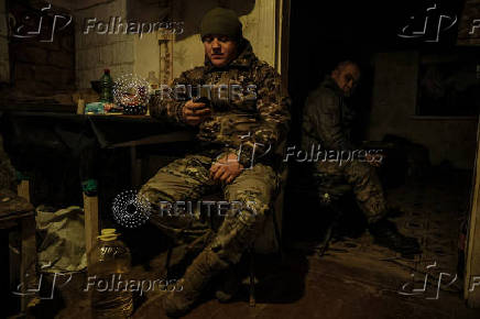 Servicemen rest at their positions near a frontline near the town of Chasiv Yar