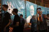 A banner of presidential candidate Masoud Pezeshkian is displayed during a campaign event in Tehran