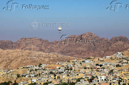 A balloon flies over Petra