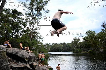 People cool off at Lake Parramatta, near Sydney