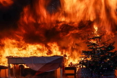 Fire department in Berlin demonstrates fire hazard from Christmas tree candles