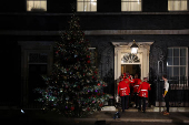 British Prime Minister Starmer and his wife switch on the Downing Street Christmas tree lights, in London