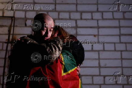 Ukrainian prisoners of war (POWs) return after a swap, in an undisclosed location