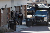 Investigators search a townhouse, in relation to the explosion in Las Vegas of a Tesla Cybertruck