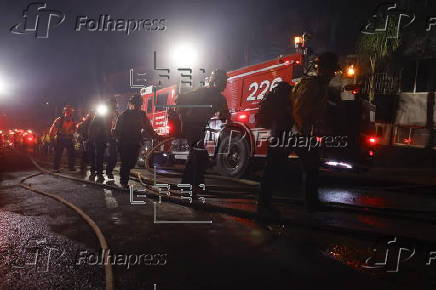 Firefighters battle the Hollywood Hills Fire in Los Angeles, California