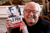 Jean-Marie Le Pen, founder of France's far-right National Front political party, holds his book of memoirs in Montretout