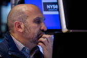 Traders work on the floor of the NYSE in New York