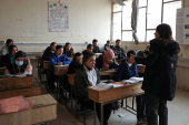 Students attend a class at a school in Qamishli