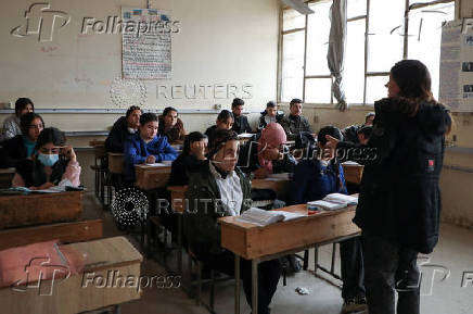 Students attend a class at a school in Qamishli