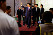 Taiwan President-elect Lai Ching-te waves during a press conference in Taipei