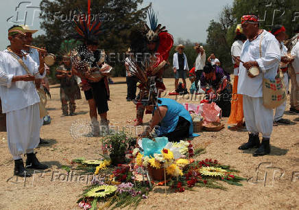 Members of Indigenous communities participate in a rain petition ritual with songs and offerings, in the archaeological site of Cuicuilco