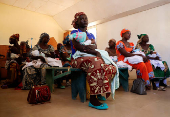 FILE PHOTO: Nursea prepare to administer the malaria vaccine to infants at the health center in Datcheka