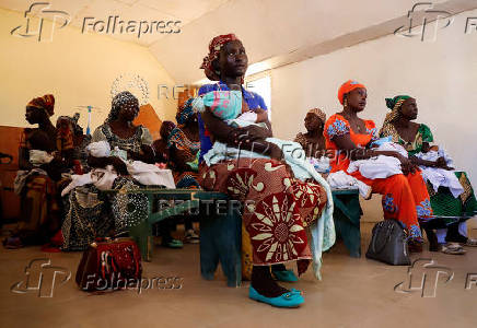 FILE PHOTO: Nursea prepare to administer the malaria vaccine to infants at the health center in Datcheka
