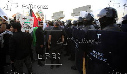 Supporters of Hezbollah Brigades protest against the killing of Nasrallah, in central Baghdad