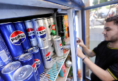 FILE PHOTO: In West Bank, Pepsi and Coke bottlers face can and sugar shortage