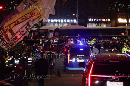 Pro-Yoon protesters participate in a rally outside a court, in Seoul