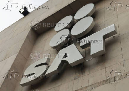 The logo of Mexico's Tax Administration Service (SAT) is seen on a wall outside its headquarters in Mexico City