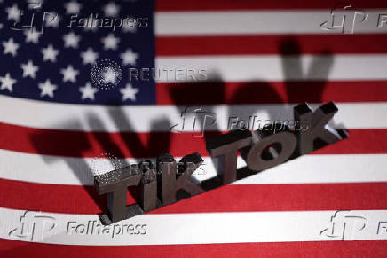 Illustration shows TikTok logo and U.S. flag