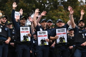 Victoria police officers and recruits walk off the job over pay and working conditions