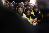 Mourners react during the funeral of Hezbollah commander Al-Hajj Mustafa Abdel Latif al-Zein, after a ceasefire agreement between Hezbollah and Israel took effect, in Beirut