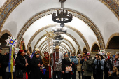 People dressed in traditional clothes sing carols inside a metro in Kyiv