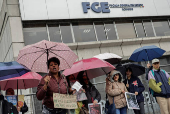 People gather to protest against the forced disappearance of four minors, in Quito